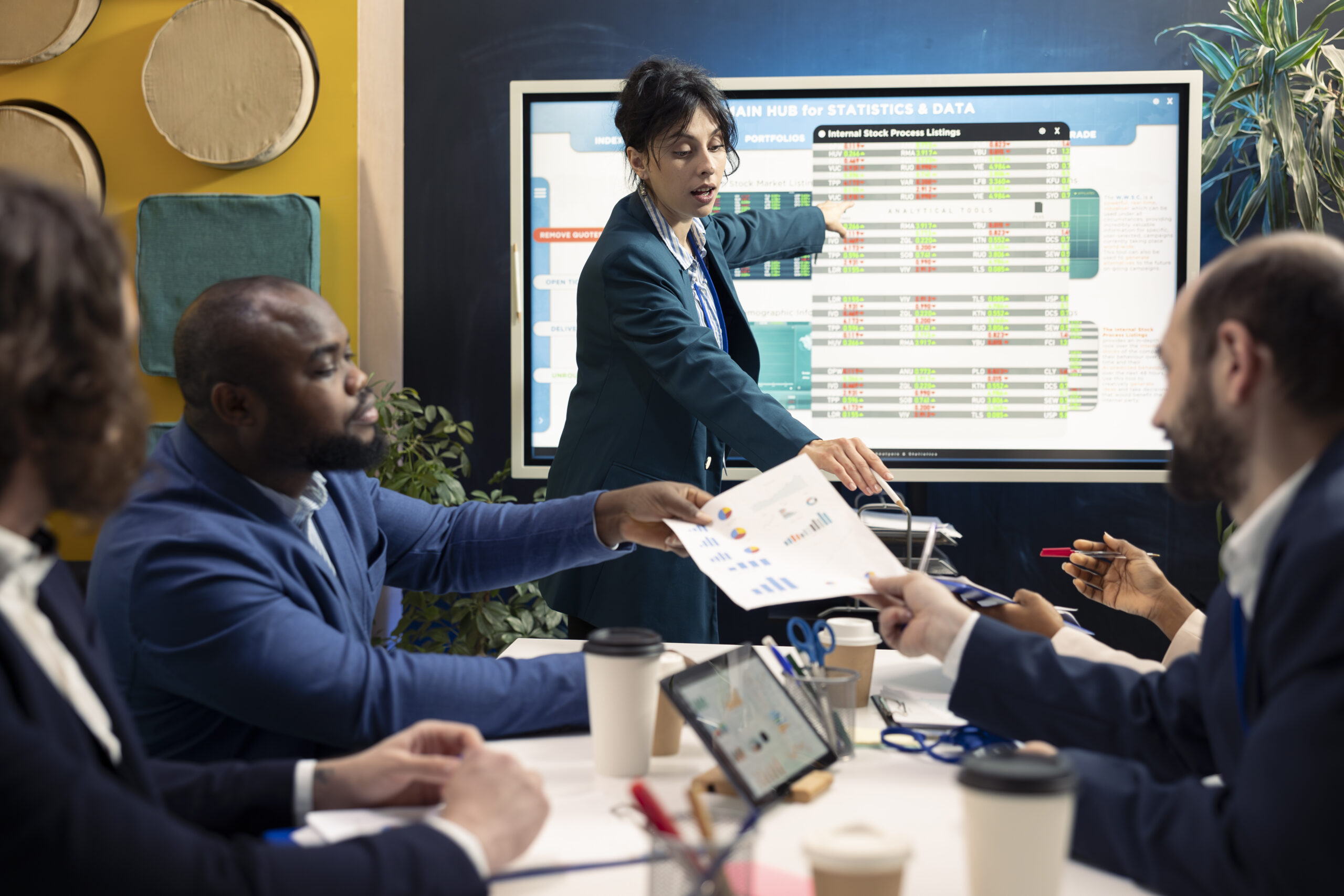 A sales team having a meeting about their effective sales strategies.
